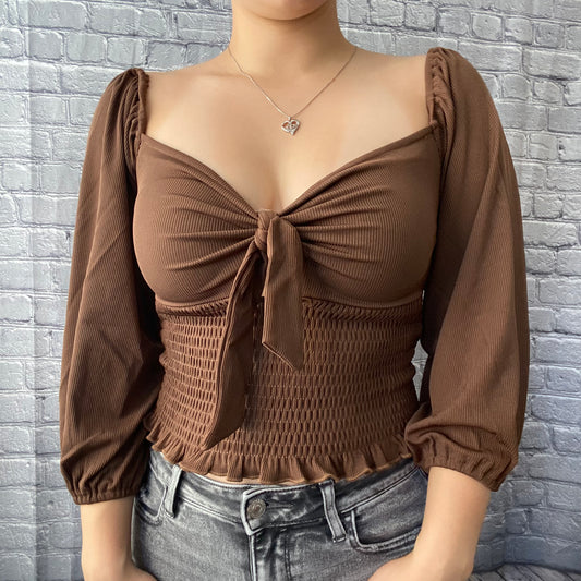 brown ballon sleeve blouse with ruched detail on torso