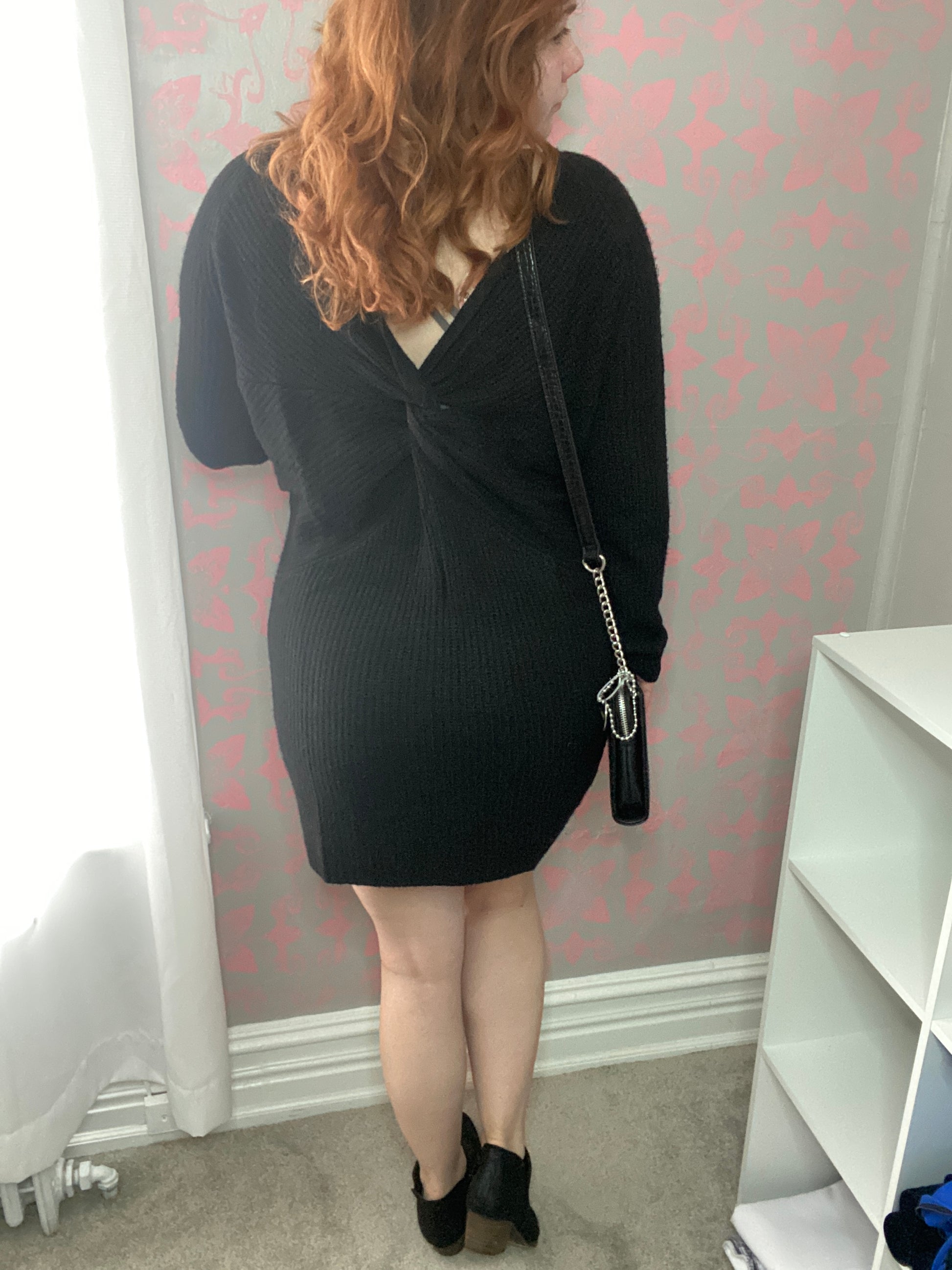 black v neck sweater dress with twist knot back 
